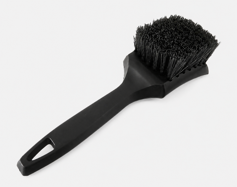 Black tyre scrubbing brush for car detailing with stiff bristles