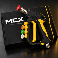 MCX Black Spray Gun 5000 PSI resting on its black MCX box