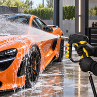 MCX Black Spray Gun 5000 PSI rinsing an orange McLaren