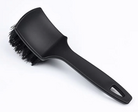 Stiff bristle tyre cleaning brush close-up