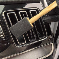 Interior detail brush cleaning tight gaps in car interior